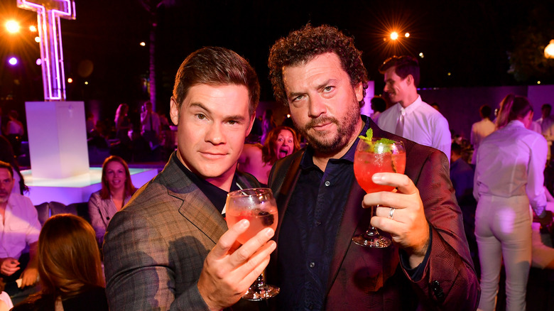 Adam Devine posing with Danny McBride