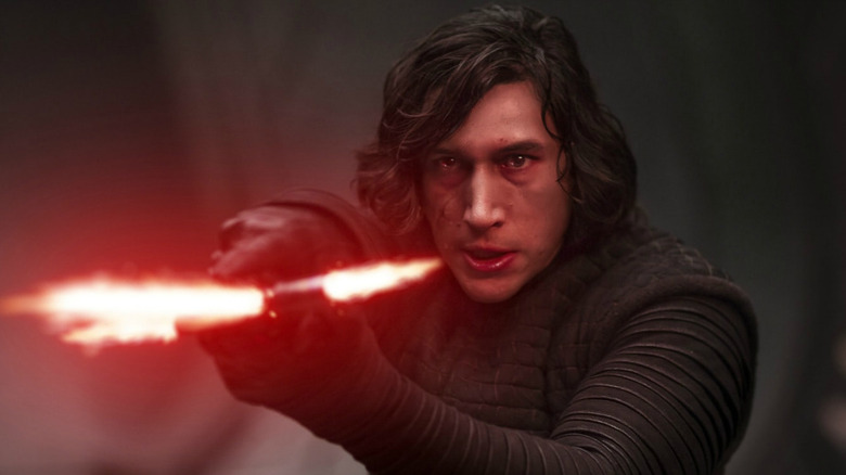 Kylo Ren holds lightsaber