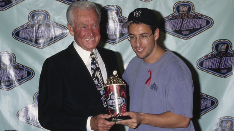 Bob Barker and Adam Sandler holding award