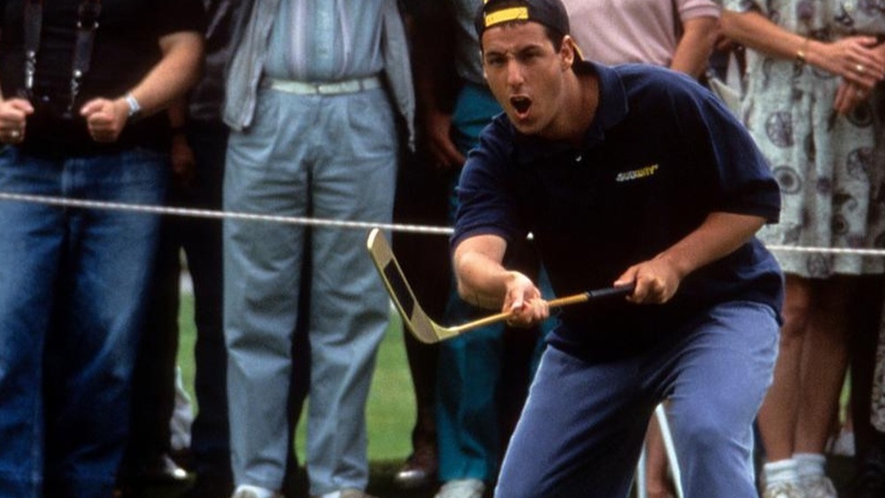 Happy Gilmore holding a hockey stick