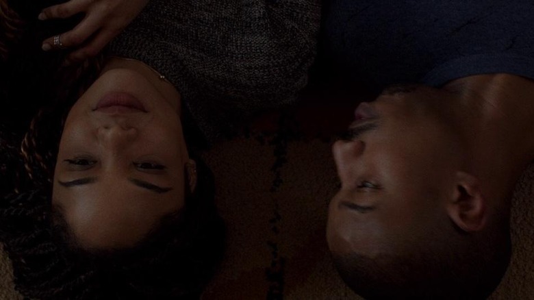 Adonis Creed and Bianca Taylor laying on the floor