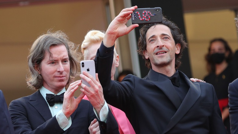 Wes Anderson and Adrien Brody posing at event