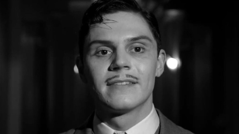 Evan Peters smirks as James Patrick March