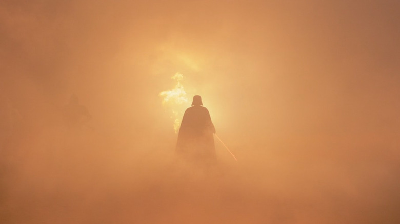 Darth Vader walks through smoke