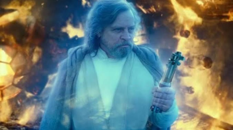 Luke Skywalker holding his lightsaber