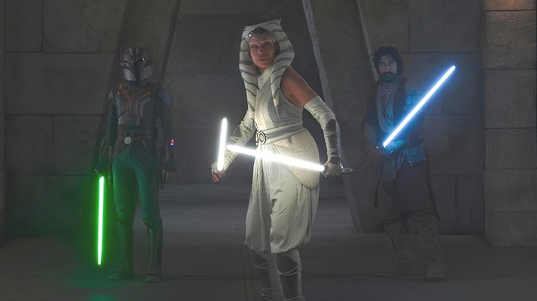 Ahsoka, Ezra, and Sabine wielding lightsabers