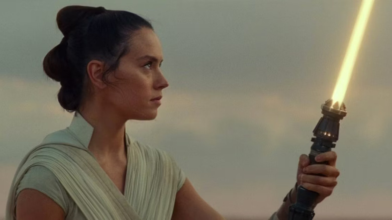 Rey ignites her yellow lightsaber