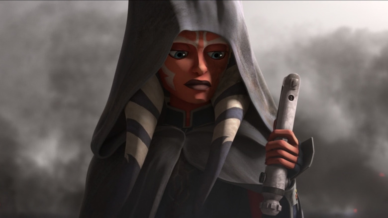 Ahsoka looks at her lightsaber