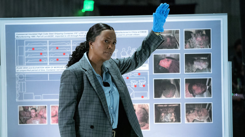Aisha Tyler as Dr. Tara Lewis wearing latex glove in Criminal Minds: Evolution