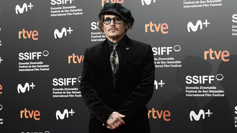 Johnny Depp wearing a black hat