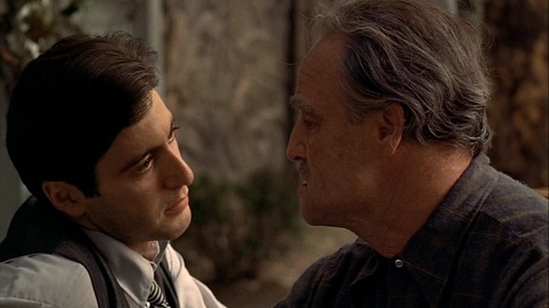 Al Pacino and Marlon Brando looking at one another