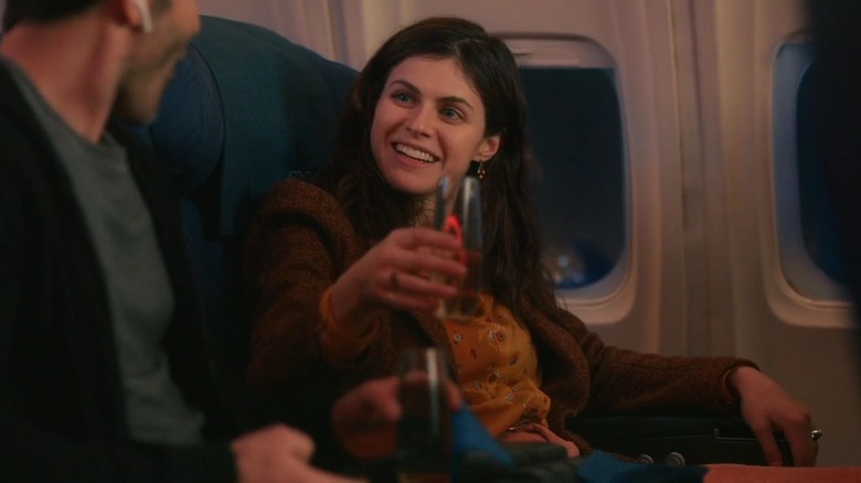 Emma drinking on an airplane