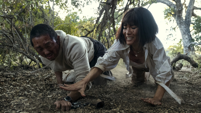 Amy and Danny fighting angrily in the woods