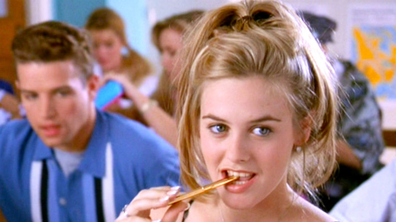Movie still from Clueless with Cher biting a pen
