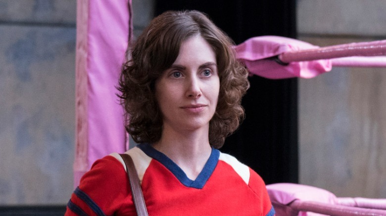 Brie stands as Ruth in GLOW