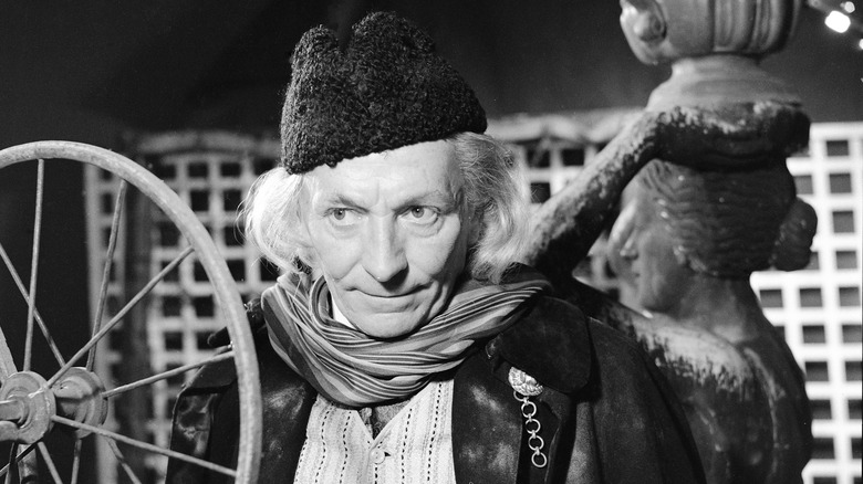 The first doctor wearing scarf and hat