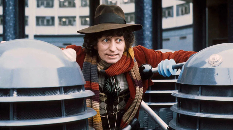 The fourth doctor surrounded by Daleks