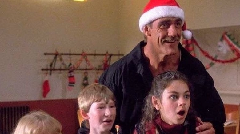 Blake smiling as the kids looked shocked in Santa with Muscles (1996)