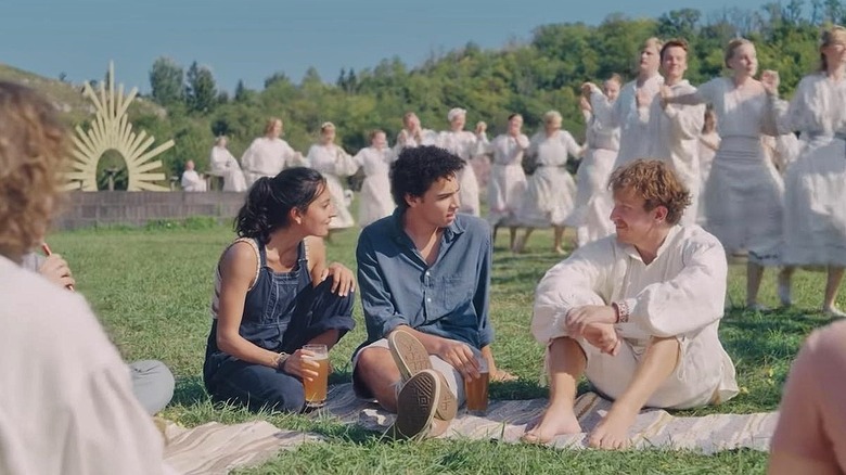 Simon sitting on the grass with Connie