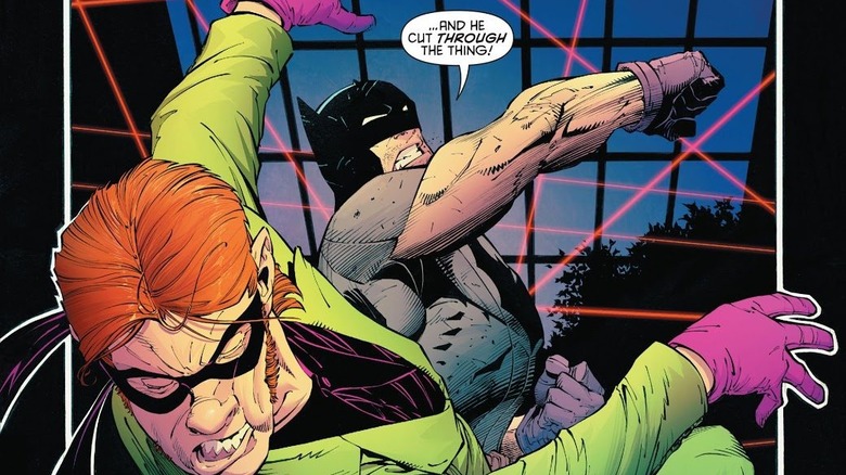 Batman punches Riddler