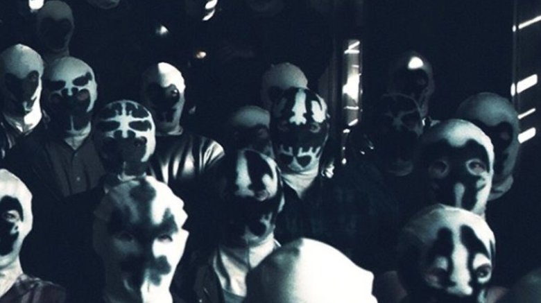 The cult of Rorschachs from a production shot of HBO's Watchmen on the series Instagram page