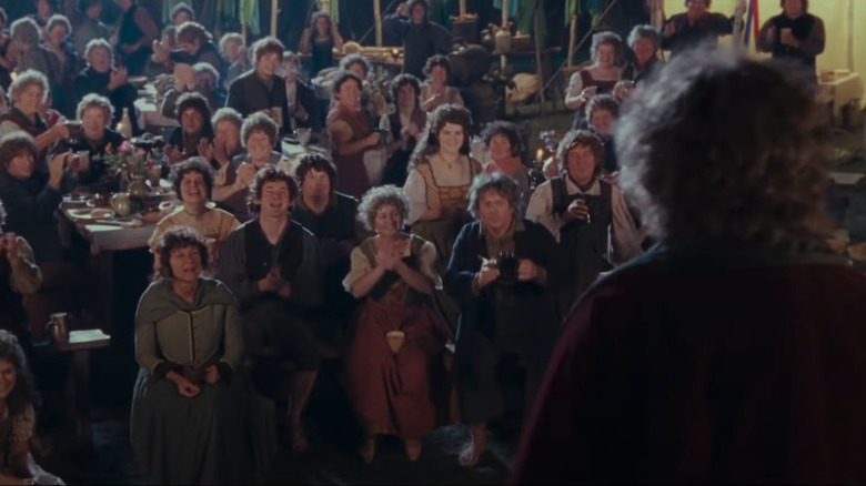 Bilbo addresses a crowd of Hobbits