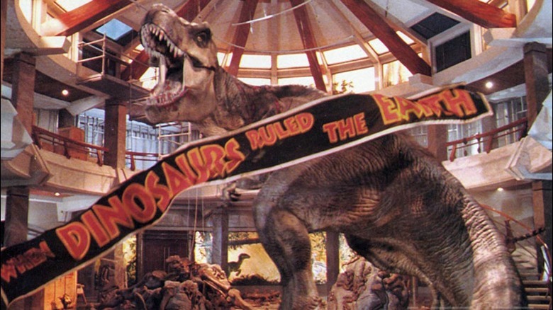 T-Rex roaring as a banner falls around it