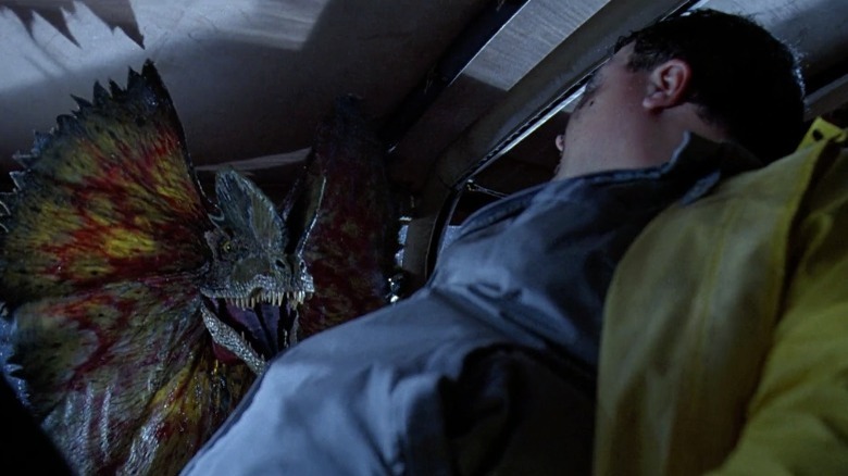 Nedry in his car confronts a Dilophosaurus