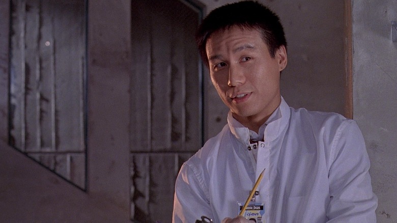 Dr. Henry Wu talking in a lab coat