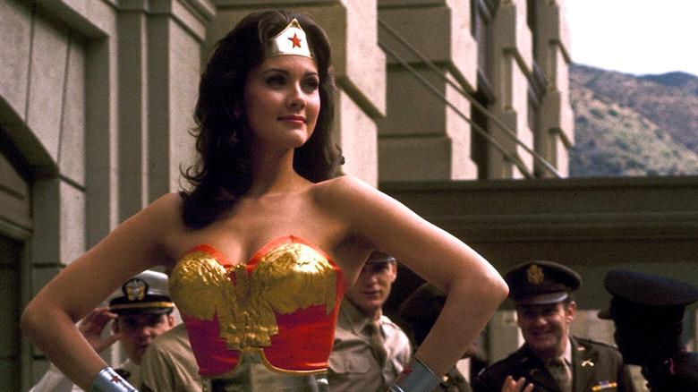 Wonder Woman stands with hands on hips