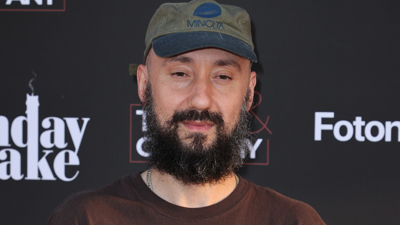 jimmy Giannopolous smiling at a press event