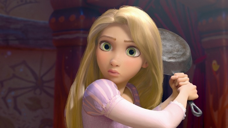 Rapunzel holding a frying pan