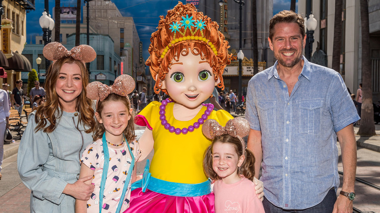 Alyson Hannigan poses with Fancy Nancy and family