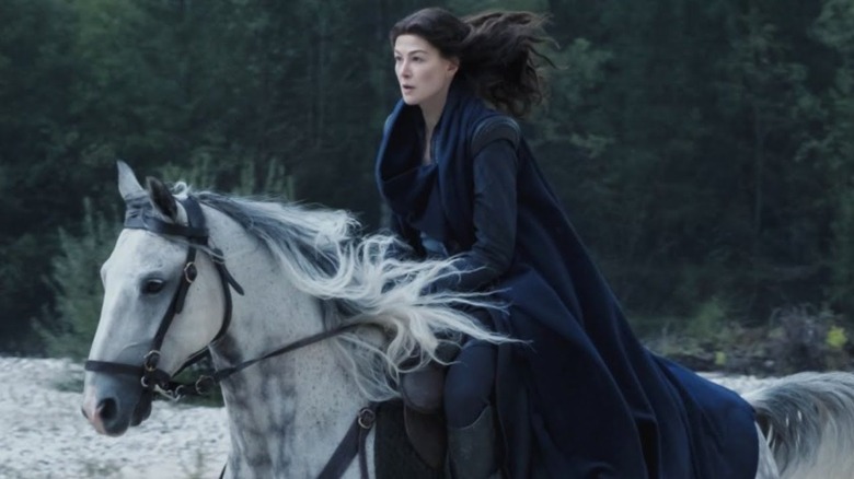 Rosamund Pike riding a horse