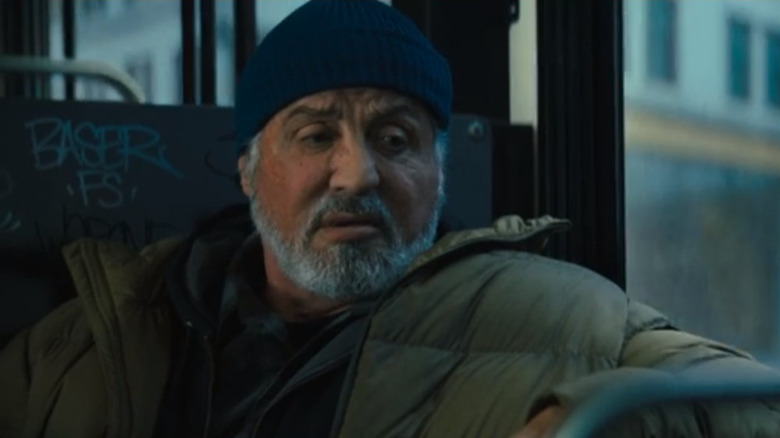 Sylvester Stallone talking on a bus