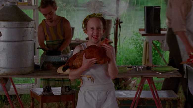 Meep holding a chicken in "Freak Show"