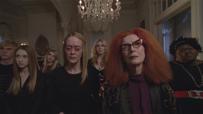 The Coven stares at Fiona's portrait 