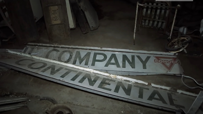 Pair of Conoco signs on the floor of a bunker