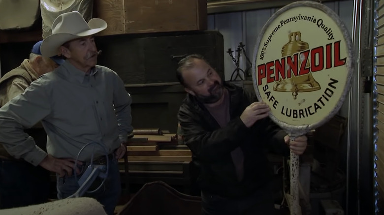 Frank Fritz and man examining a sign