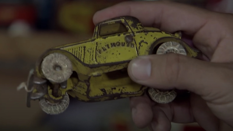 Small yellow toy car from the 1930s