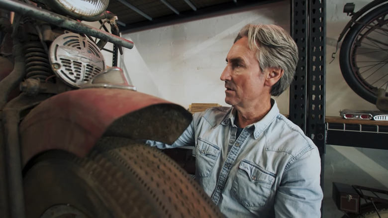 Mike Wolfe cleaning motorcycle