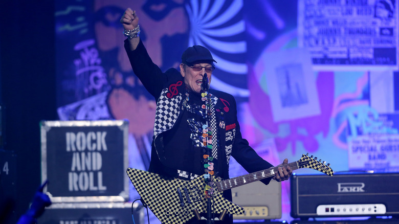 Nielsen plays a checkboard-designed guitar