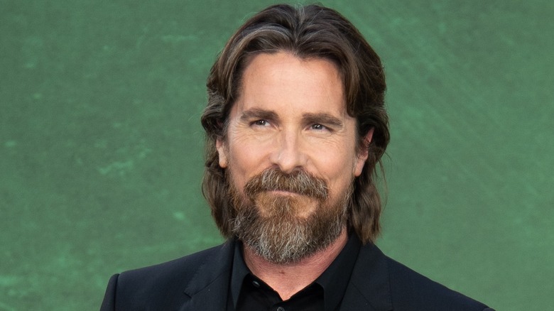 Christian Bale on green background