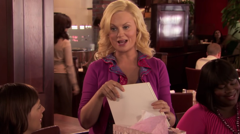 Leslie Knope handing out gifts