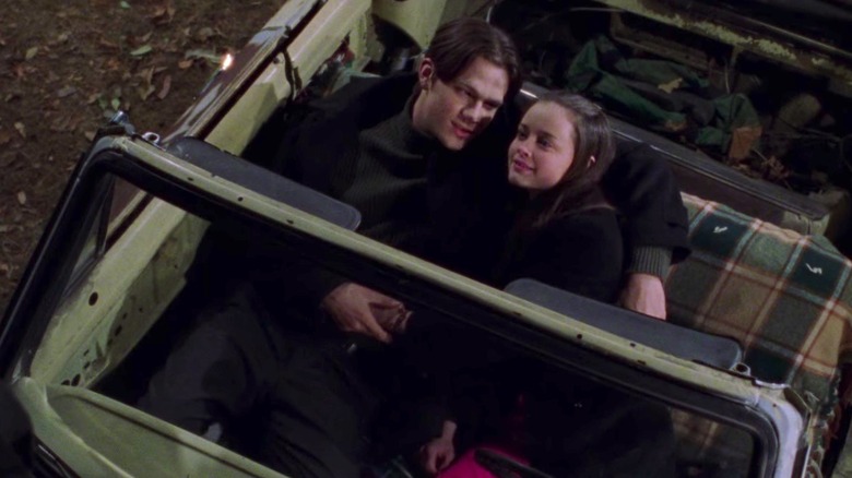 Rory and Dean lying in car