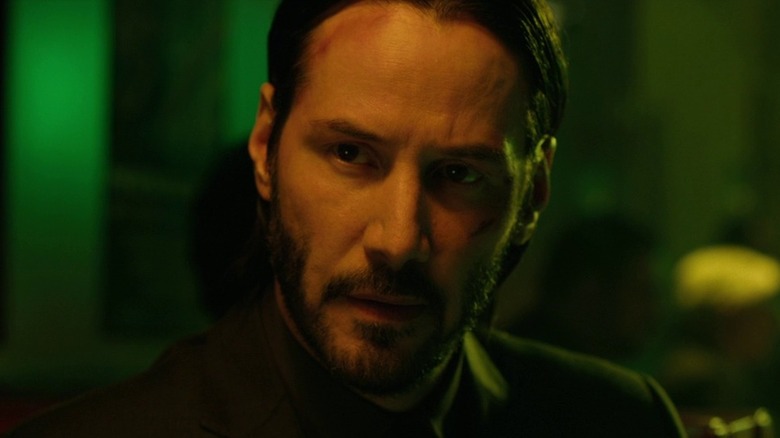 John Wick looking behind him