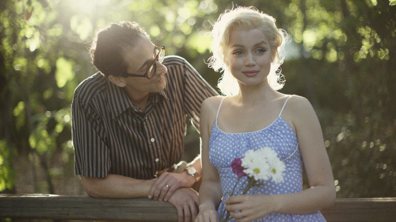 Marilyn smiles beside Arthur Miller