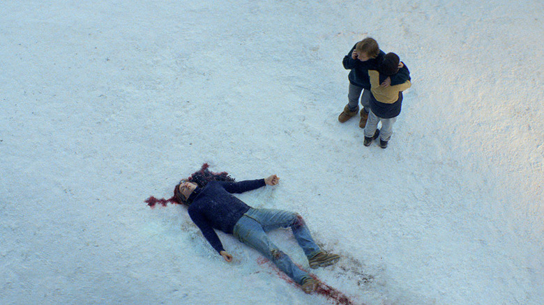 Sandra and Daniel stand by Samuel's corpse