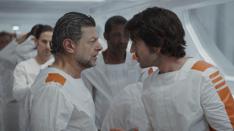 Andy Serkis and Diego Luna exchanging tense looks in Andor