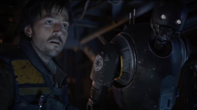 Cassian Andor standing next to K-2SO